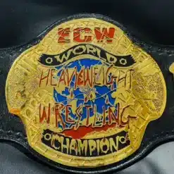 Close-up of the ECW World Heavyweight Champion center plate, featuring deep HD engraving and 24K gold plating