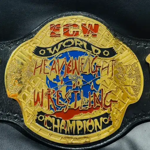 Close-up of the ECW World Heavyweight Champion center plate, featuring deep HD engraving and 24K gold plating