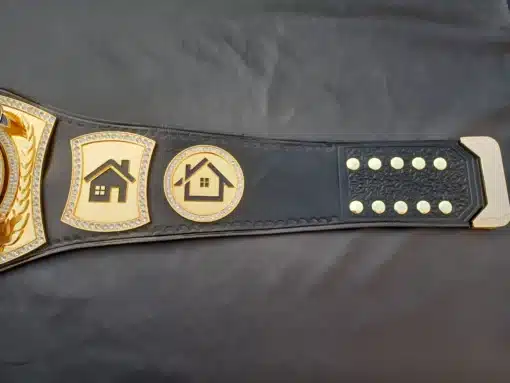 Durable genuine leather strap with a gold-plated metal buckle on a custom real estate championship belt for premium quality.