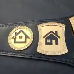 Engraved gold-plated side plates featuring a house logo on a custom real estate championship belt for realtors and brokers.