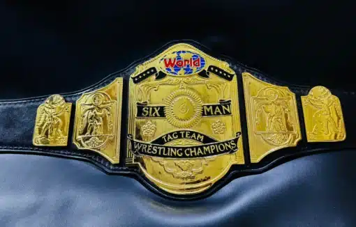 Detailed gold-plated center plate with Six-Man Tag Team Wrestling Champions engraving, featuring a high-quality replica design.