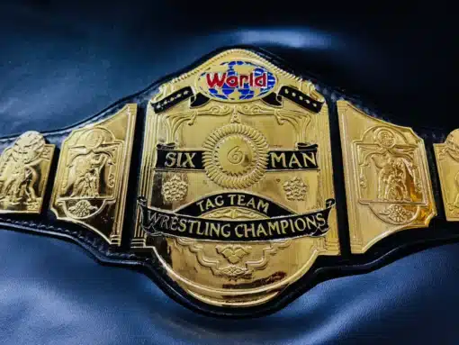 restling championship belt, highlighting detailed engravings and gold plating.