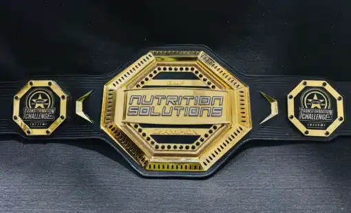 Gold-plated fitness championship belt with custom engraving for winners, featuring an octagon-shaped center plate and black leather strap.