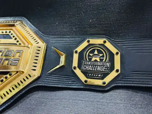 Eye-catching gold trophy belt for fitness events, featuring a customized center plate and octagon side plates.