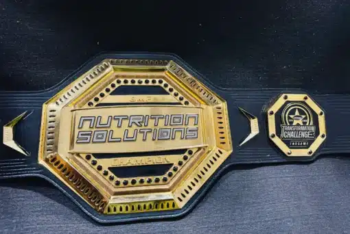 Personalized gym award championship belt with engraved fitness transformation details and a durable leather strap.