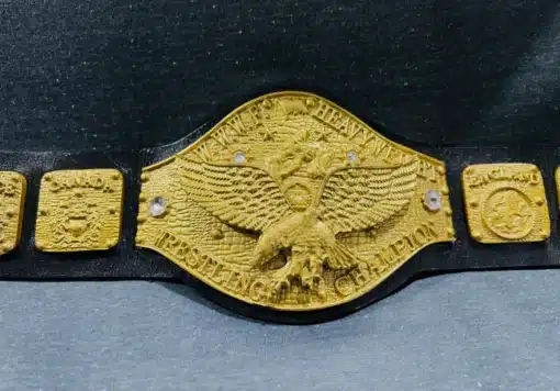 Old school WWWF Championship Belt from the 1970s, showcasing a gold-plated eagle center plate and detailed side plates