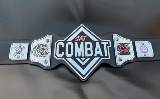 Close-up of SAJ Combat Championship Belt's main plate, featuring high-definition engraving and a bold combat-inspired design.