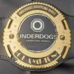 Close-up view of the Underdogs Grappling Series Championship Belt with gold-plated zinc etching