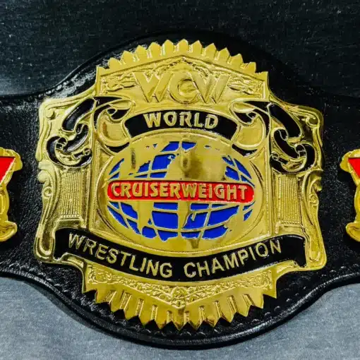 Close-up shot highlighting the deep-etched gold plates and fine details of the WCW title.