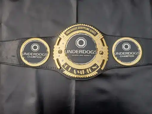 Detailed view of the custom grappling championship belt featuring 4mm thick zinc etching plates