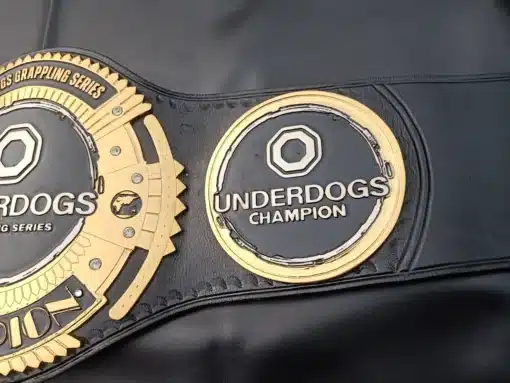 An Underdogs Champion title belt designed for top-performing athletes in combat sports, MMA, and grappling.