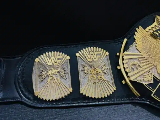 High-definition side plates of the WWF Winged Eagle Belt replica with gold and chrome dual-plating.