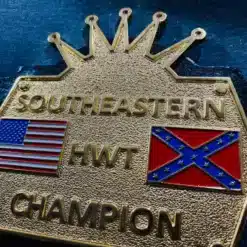 Angled view of the Southeastern Championship Belt, showing its gold-plated plates and deep HD engraving.