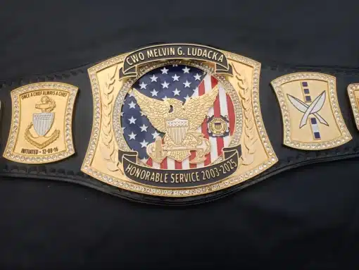 Military belt honoring years of service with rank insignias and colorful ribbon display
