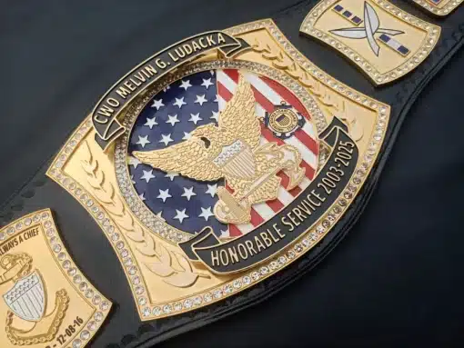 Retirement belt customized for Coast Guard members with gold plates and unit insignia