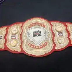 Red leather championship belt honoring leadership with custom engraved names and titles