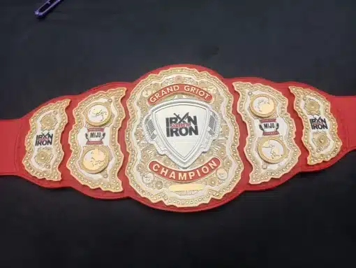 Red leather championship belt honoring leadership with custom engraved names and titles