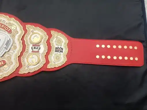 Belt centerplate featuring microphone design and Iron Sharpeth Iron logo for cultural storytelling champions