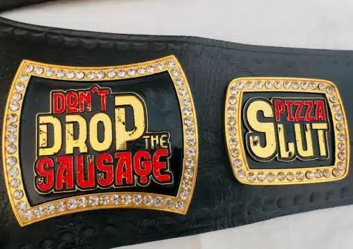 Funny engraved plate saying “Don’t Drop the Sausage” with gold trim and crystals.