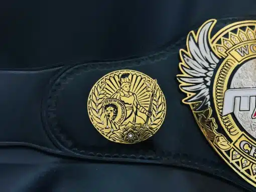 Warrior-themed side plate on MLW replica belt with laurel wreath and classic wrestling style