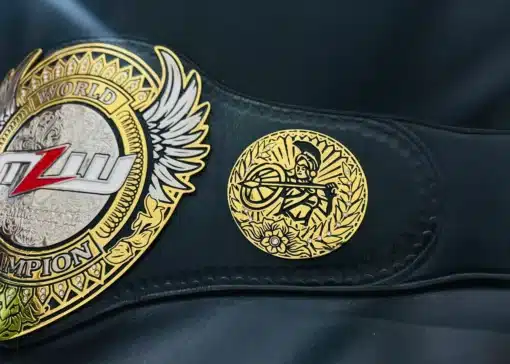 Close-up of ornate side plate with warrior and flower design on MLW World Title replica