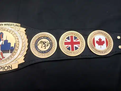 Custom-made wrestling belt featuring skyline engraving and championship wrestler pose
