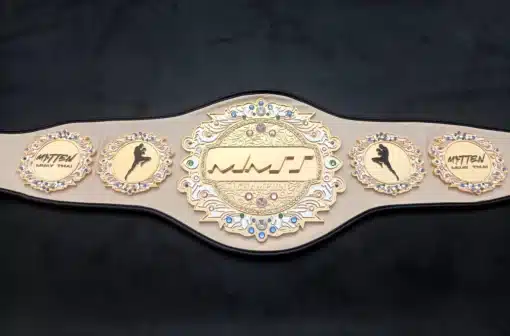 Full front view of the MMT Muay Thai championship belt on black background