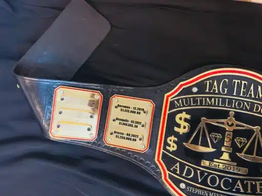 Real estate award championship belt with shiny gold plates and customizable winner nameplates.