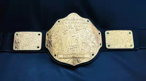 Full front view of Warzone Fantasy Football championship belt with 4mm zinc HD engraved plates, deep nugget texture, gold finish, and black leather strap.