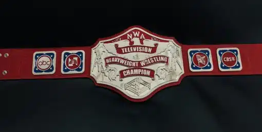 Complete view of replica NWA TV Champion belt with side plates and red leather strap.