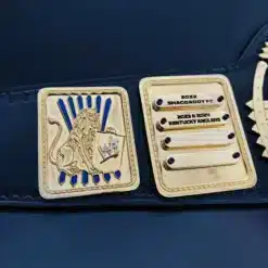 Personalized side plates on fantasy football championship belt with lion crest