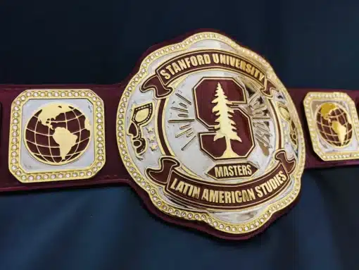 Close-up of custom side plates featuring globe and luchador graduate mask icon