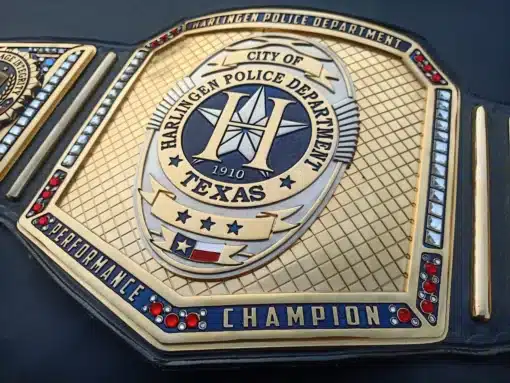 Custom belt center plate featuring USA and Texas flag elements designed for official department awards