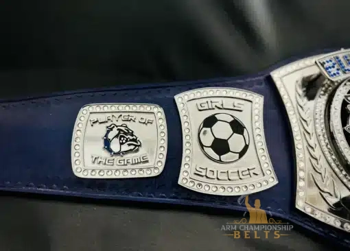 Close-up of side plates showing “Girls Soccer” and Bulldog logo