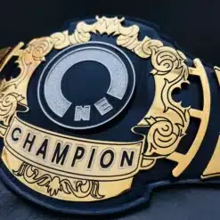 Close-up of spinning “ONE” center plate on engraved gold belt