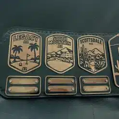 Removable nameplates on championship belt for yearly golf winners