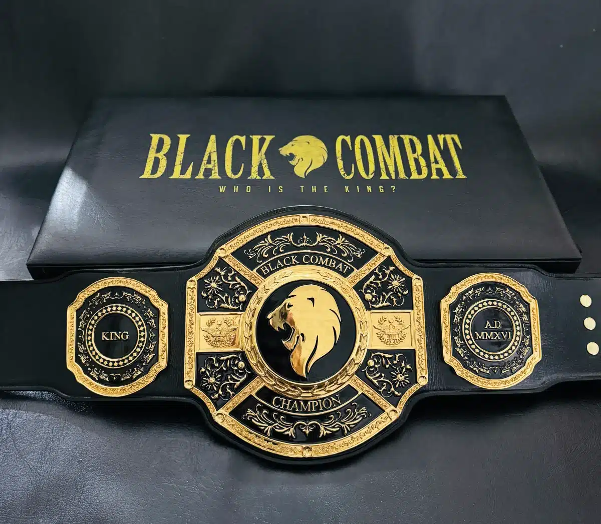 Front view of the Combat Championship Belt with black leather strap and gold HD engraving