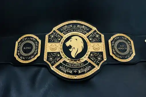 MMA fighter holding black custom Combat King belt after winning match