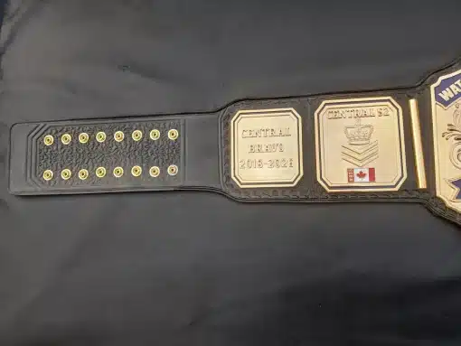 Police retirement championship belt engraved with service years and unit designation