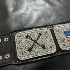 Side plates of custom wrestling federation championship belt featuring engraved symbols and country flags