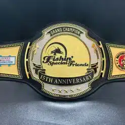 Full front view of custom Grand Champion anniversary championship belt with shiny gold finish, nugget texture, and corporate brand center plate.
