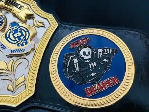 Custom unit and morale emblem side plate on Inspector General championship belt with deep HD engraving and gold finish.