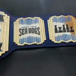 Close-up of 5mm deep HD engraved plates with gold and chrome finish on custom hockey championship belt