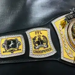 Custom GOAT and undisputed champion side plates engraved on fantasy football league trophy belt.