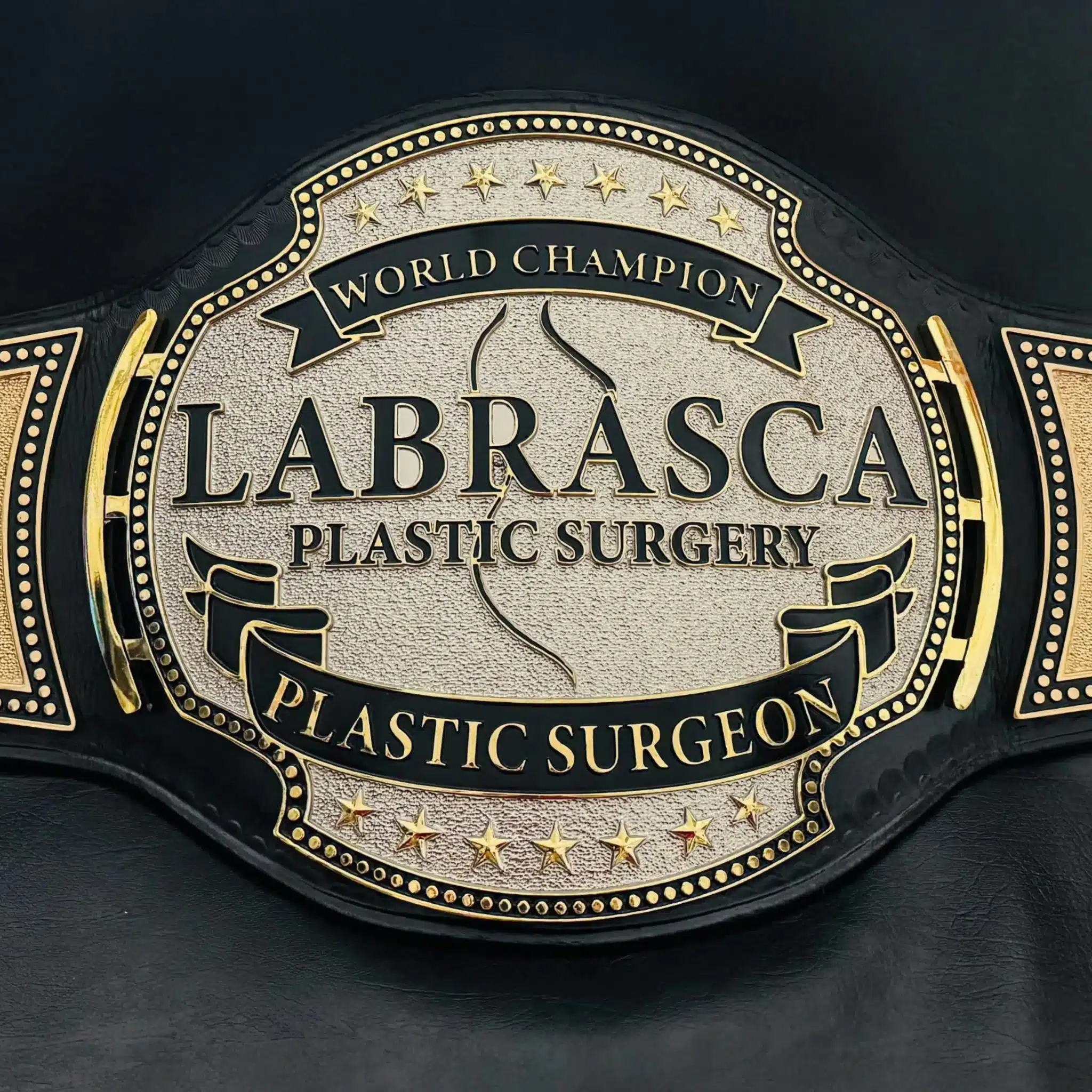 HD engraved center plate on custom professional championship belt with brand name and title